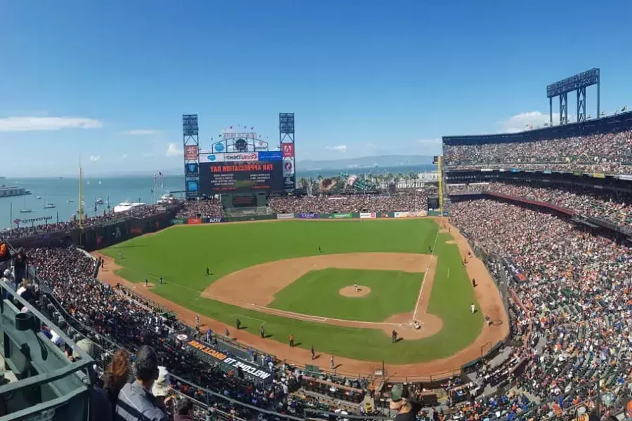 A view of 贝博体彩app's 甲骨文公园 looking out from the stands, with the baseball diamond in the foreground and 贝博体彩app Bay in the background.